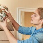 woman unpacking valuables after a move