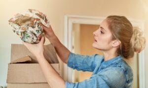 woman unpacking valuables after a move